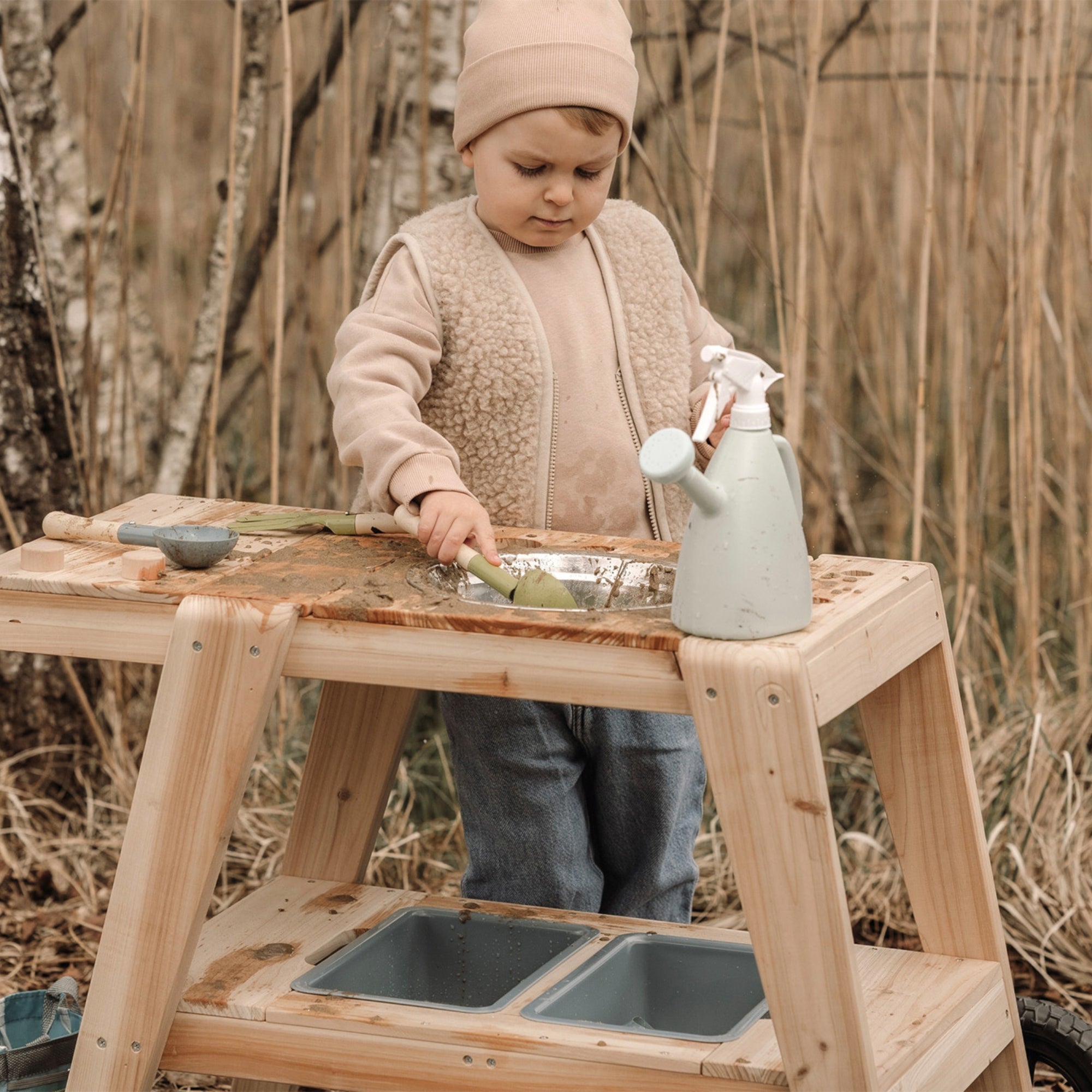 Compact Mud Kitchen,Introducing the Compact Mud Kitchen: Where endless outdoor adventures await! Perfectly designed for small gardens, terraces, or balconies, this nature-inspired play kitchen brings the joy of mud and sand play right to your doorstep. Crafted from natural, untreated solid wood, this outdoor kitchen radiates rustic charm while offering robust durability. Despite its compact size, it provides ample space for imaginative play, allowing children to explore and create from all sides. Equipped w