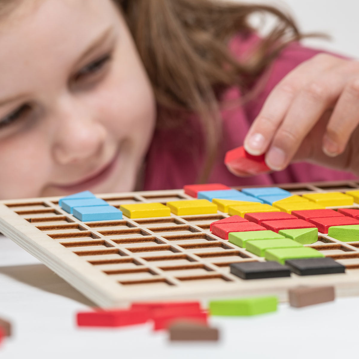Wooden Mosaic Set,The 116 piece Wooden Mosaic Set is a fantastic way for children to engage in creative and stimulating play, while also developing important skills such as fine motor control, problem-solving and colour recognition. With a range of 20 designs to choose from, or the freedom to create their own patterns, children will love the challenge of fitting the colourful wooden squares and triangles into the wooden grid. The pieces come in six vibrant colours and are made from sustainably sourced Beech
