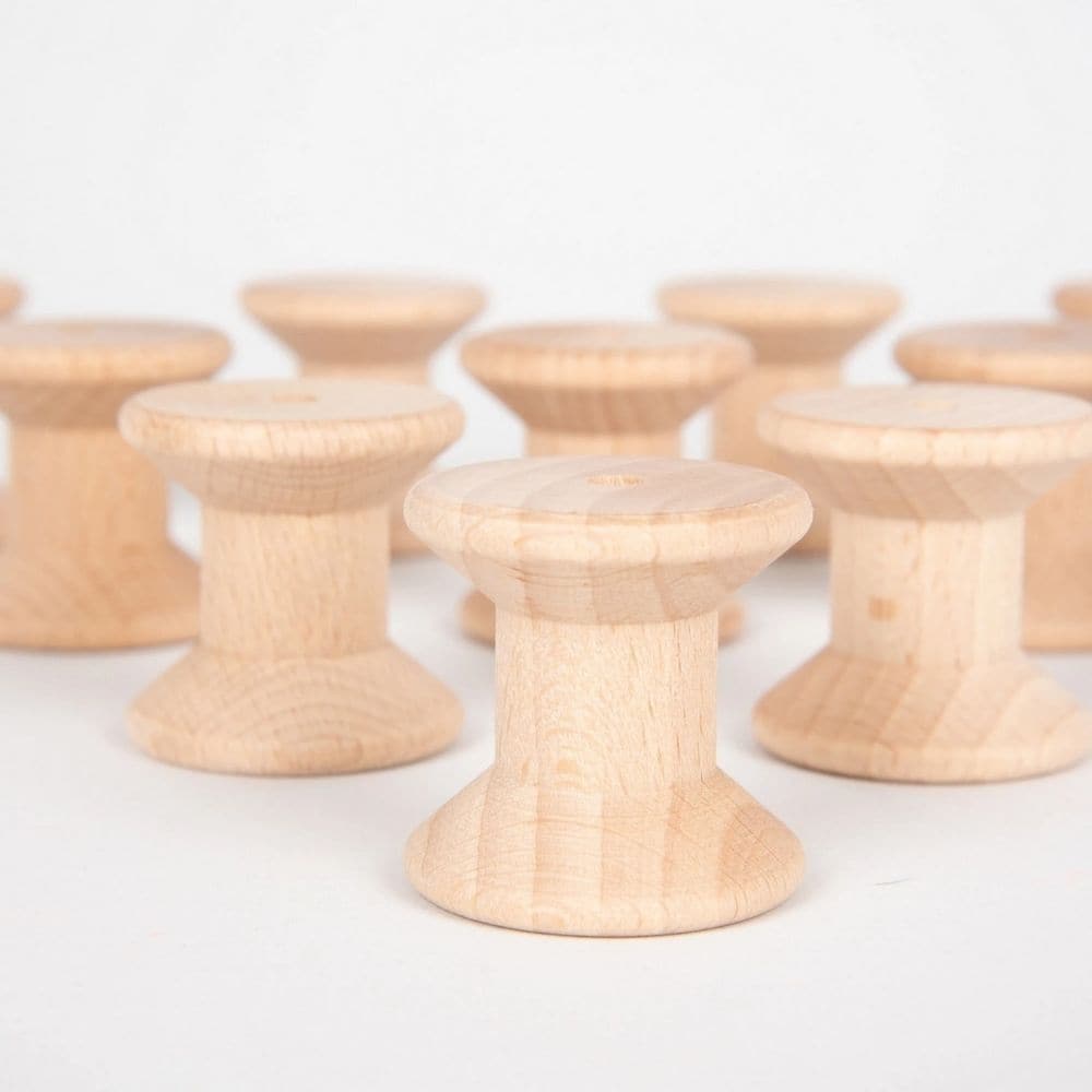 Wooden Spool Set 10pk,Designed to open up a new world of discovery and play, this Wooden Spool Pack of 10 is ideal for igniting the imagination in toddlers. Designed for heuristic play which is rooted in children's natural curiosity, these simple wooden spools create a treasure trove of play ideas that help to develop their playing and cognitive skills. Allow children to feel, pair and stack these beechwood objects again and again and you'll help to develop an open environment where the world of play merges