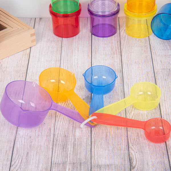 Tickit® Translucent Colour Measuring Cups,Explore the world of imaginative play and early education with our tickit® Translucent Colour Measuring Cups – the perfect companions for your child's adventures in sand and water play. Designed with ease of use in mind, these measuring cups feature simple pouring lips on each side, making them a delight for little hands to hold and manipulate. The Tickit® Translucent Colour Measuring Cups set is made up of five vibrant colors and various sizes, these measuring cups